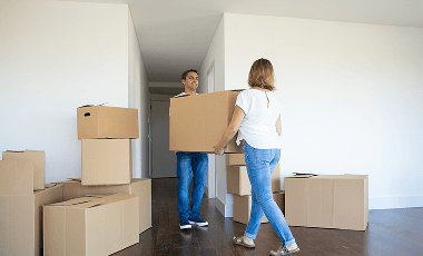 married-couple-leaving-apartment-carrying-cartoon-box-entrance-together 1 (3)