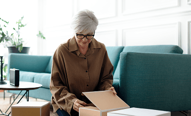 woman-unpacking-brown-boxes-living-room 1 (2)